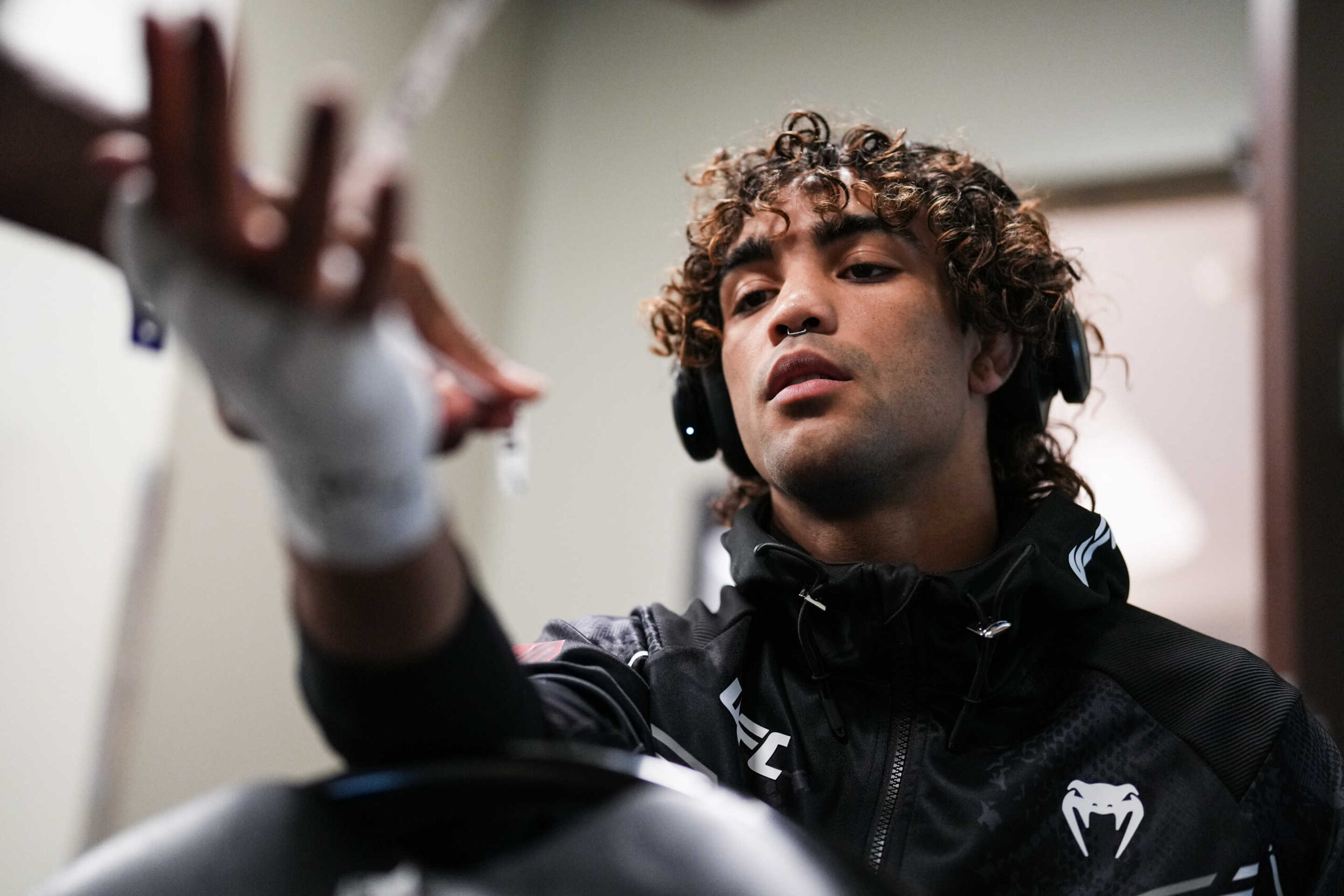 LAS VEGAS, NEVADA - JUNE 29: Payton Talbott gets his hands wrapped prior to his bantamweight fight during the UFC 303 event at T-Mobile Arena on June 29, 2024 in Las Vegas, Nevada. (Photo by Cooper Neill/Zuffa LLC via Getty Images)