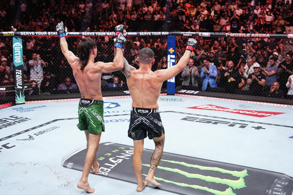 LAS VEGAS, NEVADA - JUNE 29: (L-R) Diego Lopes of Brazil and Dan Ige celebrate after the conclusion of their 165-pound catchweight fight during the UFC 303 event at T-Mobile Arena on June 29, 2024 in Las Vegas, Nevada. (Photo by Jeff Bottari/Zuffa LLC via Getty Images)