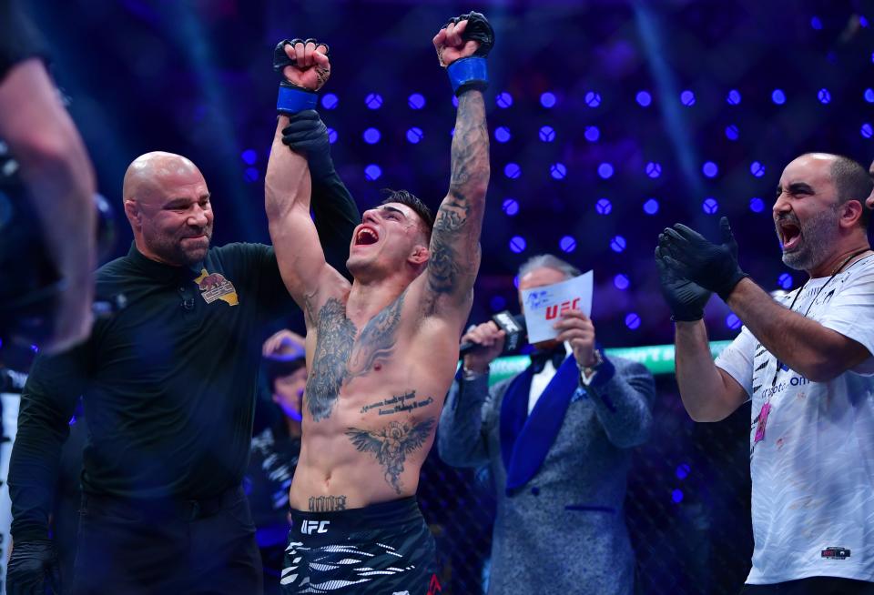 Jan 18, 2025; Inglewood, California, USA; Benardo Sopaj (blue gloves) reacts after defeating Ricky Turcios (red gloves) during UFC 311 at Intuit Dome. Mandatory Credit: Gary A. Vasquez-Imagn Images