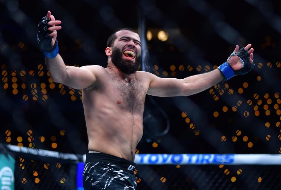 Jan 18, 2025; Inglewood, California, USA; Muin Gafurov (blue gloves) reacts after defeating Rinya Nakamura (not pictured) during UFC 311 at Intuit Dome. Mandatory Credit: Gary A. Vasquez-Imagn Images