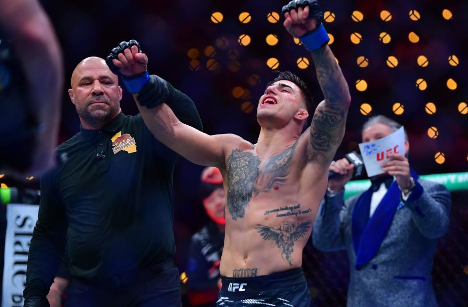 Jan 18, 2025; Inglewood, California, USA; Benardo Sopaj (blue gloves) reacts after defeating Ricky Turcios (red gloves) during UFC 311 at Intuit Dome. Mandatory Credit: Gary A. Vasquez-Imagn Images