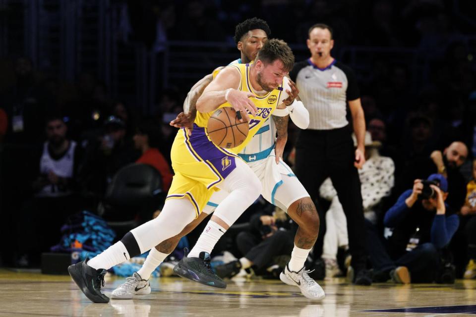 Lakers guard Luka Doncic drives to the basket against Hornets guard Elfrid Payton during a game last week at Crypto.com Arena