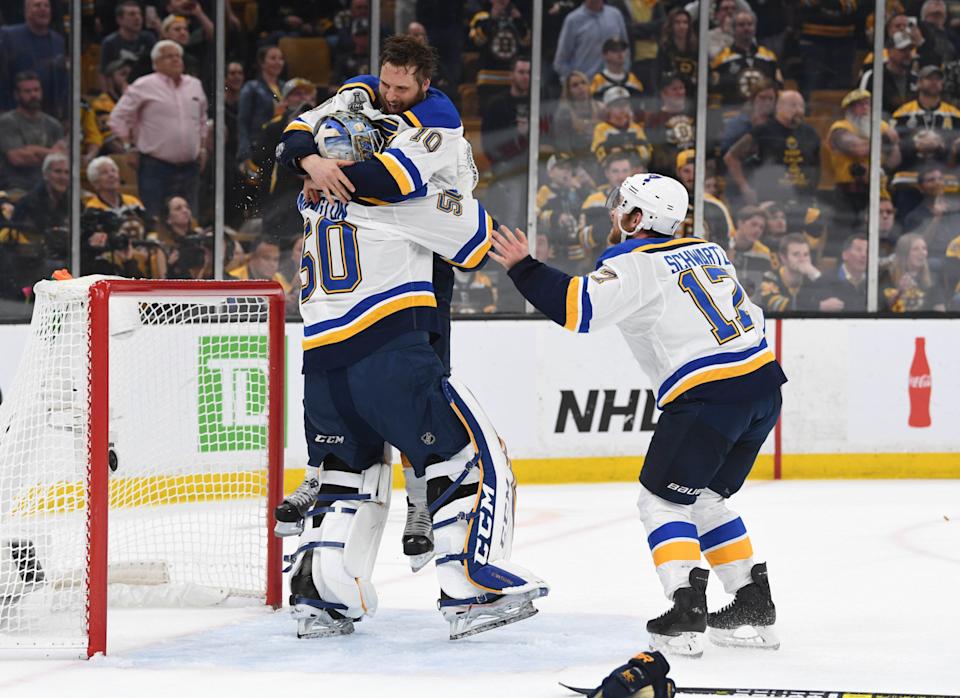 Brayden Schenn (10) jumps into the arms of Jordan Binnington with Jaden Schwartz soon to follow after the St. Louis Blues won the Stanley Cup in 2019 against the Boston Bruins. (Brian Fluharty-Imagn Images).