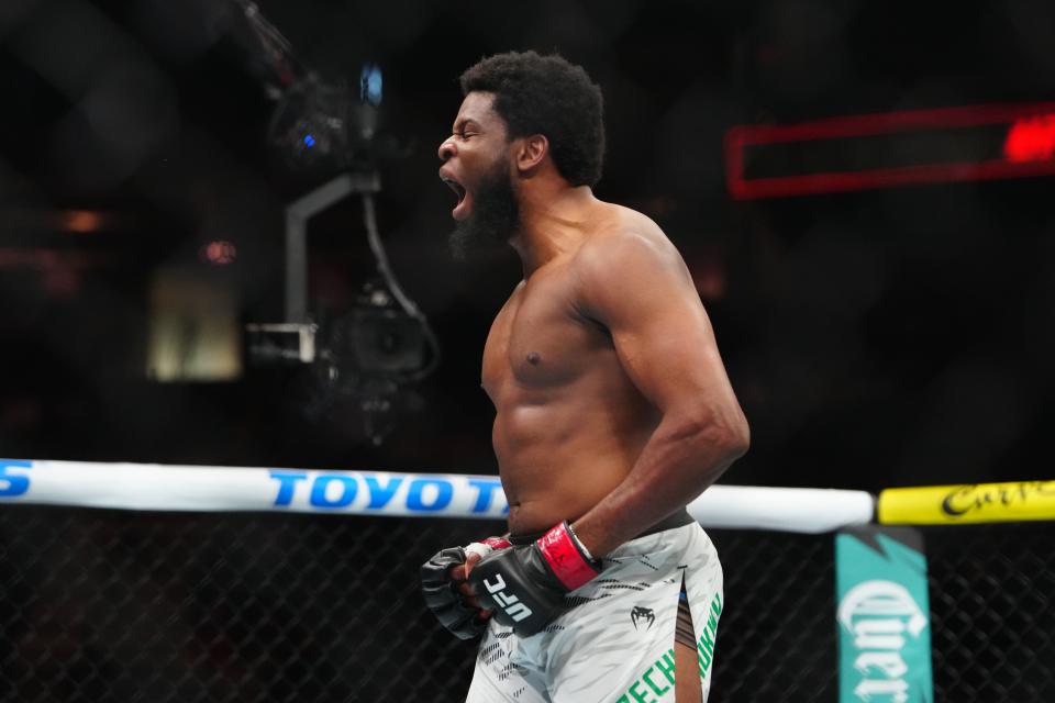 Dec 7, 2024; Las Vegas, Nevada, UNITED STATES; Kennedy Nzechukwu (red gloves) reacts to defeating Lukasz Brzeski (blue gloves) at T-Mobile Arena. Mandatory Credit: Stephen R. Sylvanie-Imagn Images