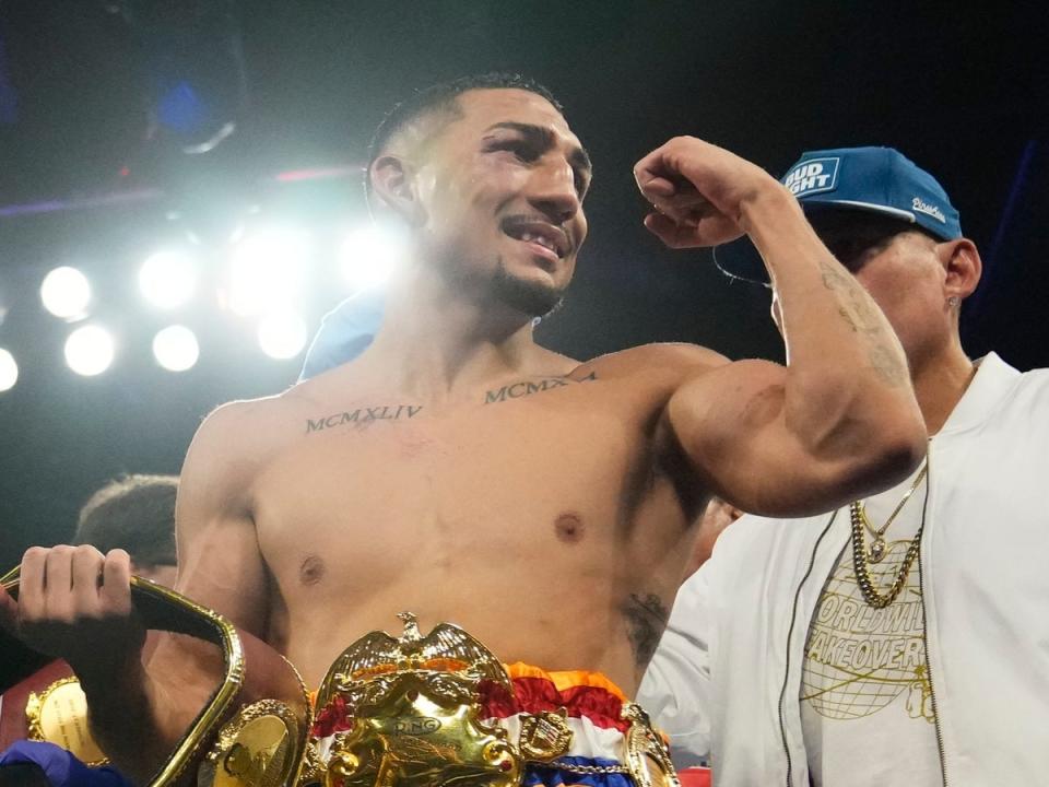 Teofimo Lopez celebrates dethroning Josh Taylor in 2023 (AP)