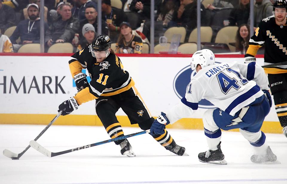 Nov 19, 2024; Pittsburgh, Pennsylvania, USA; Pittsburgh Penguins center Vasily Ponomarev (11) skates with the puck against the Tampa Bay Lightning during the third period at PPG Paints Arena. (Charles LeClaire-Imagn Images)