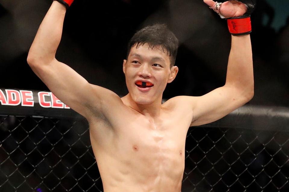 Aug 31, 2019; Shenzhen, China; Su Muaderji (red gloves) and Andre Soukhamathath (blue gloves) during UFC Fight Night at Shenzhen Universiade Sports Centre. Mandatory Credit: David G. McIntyre-USA TODAY Sports