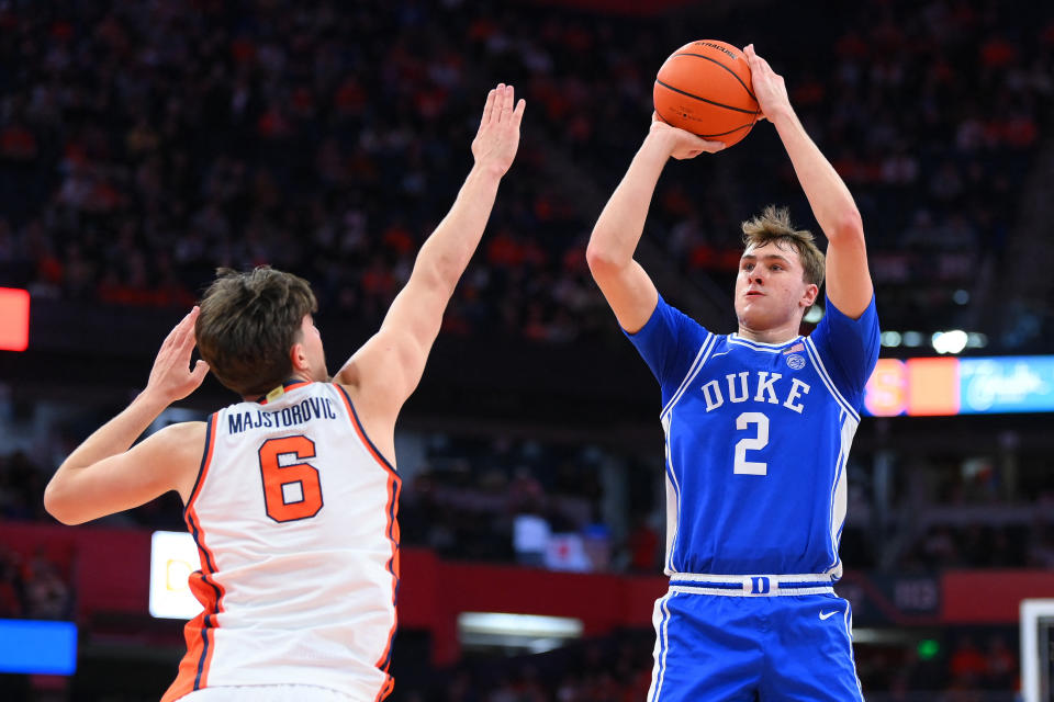 Feb 5, 2025; Syracuse, New York, USA; Duke Blue Devils guard Cooper Flagg (2) shoots against Syracuse Orange forward Petar Majstorovic (6) during the first half at the JMA Wireless Dome. Mandatory Credit: Rich Barnes-Imagn Images