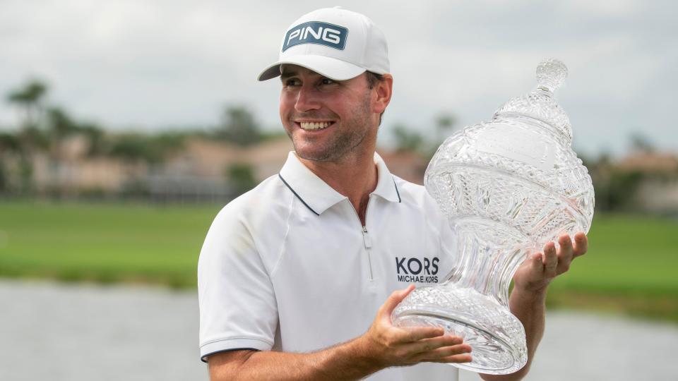 Austin Eckroat holds the trophy after winning he Cognizant Classic in The Palm Beaches at PGA National Resort & Spa on March 4, 2024 in Palm Beach Gardens, Florida.