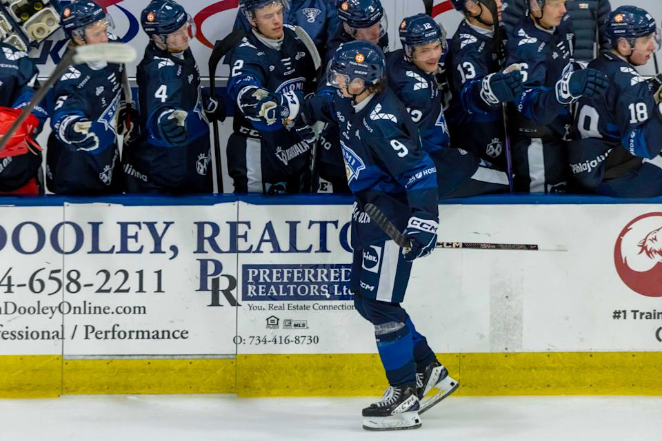 Aug 2, 2024; Plymouth, MI, USA; Finland's defenseman Emil Pieniniemi (9) celebrates a power play goal against Canada with teammates on the bench during the second period of the 2024 World Junior Summer Showcase at USA Hockey Arena. (David Reginek-Imagn Images)