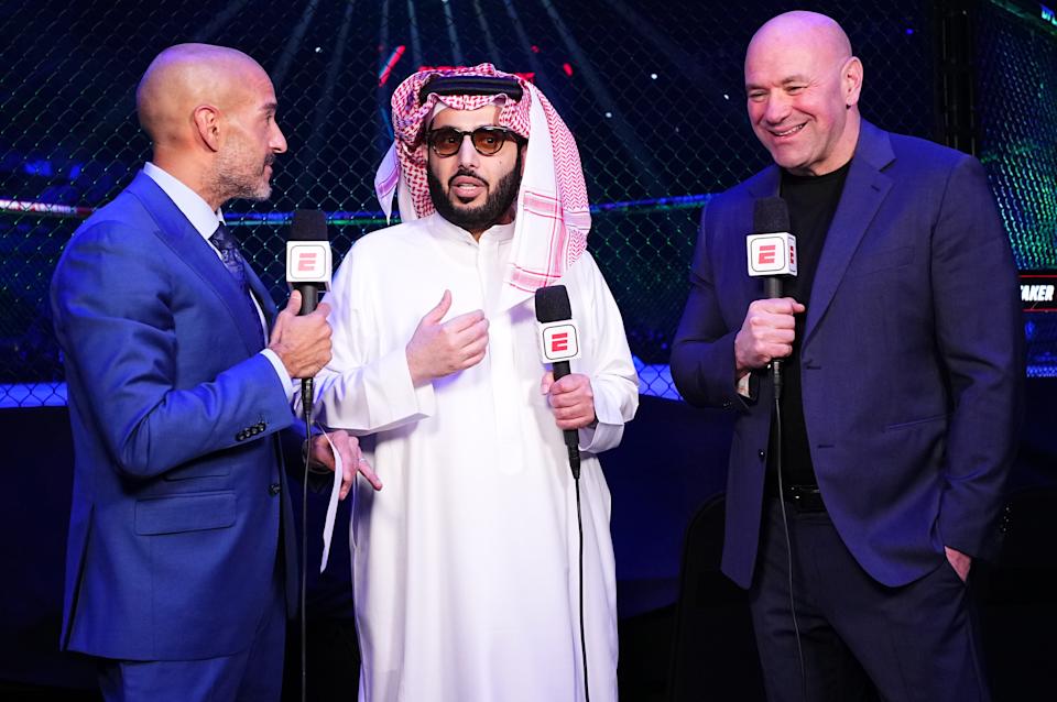 RIYADH, SAUDI ARABIA - JUNE 22: (L-R) Jon Anik, His Excellency Turki Alalshikh, and UFC CEO Dana White are seen on the broadcast during the UFC Fight Night event at Kingdom Arena on June 22, 2024 in Riyadh, Saudi Arabia. (Photo by Chris Unger/Zuffa LLC via Getty Images)