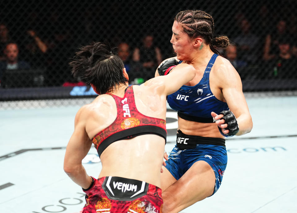 SYDNEY, AUSTRALIA - FEBRUARY 09: (L-R) Zhang Weili of China punches Tatiana Suarez in the UFC strawweight championship fight during the UFC 312 event at Qudos Bank Arena on February 09, 2025 in Sydney, Australia.  (Photo by Jeff Bottari/Zuffa LLC)