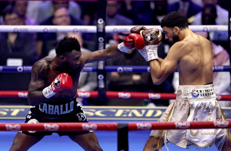 Hamzah Sheeraz (right) was fortunate to get a draw against Carlos Adames (Reuters)