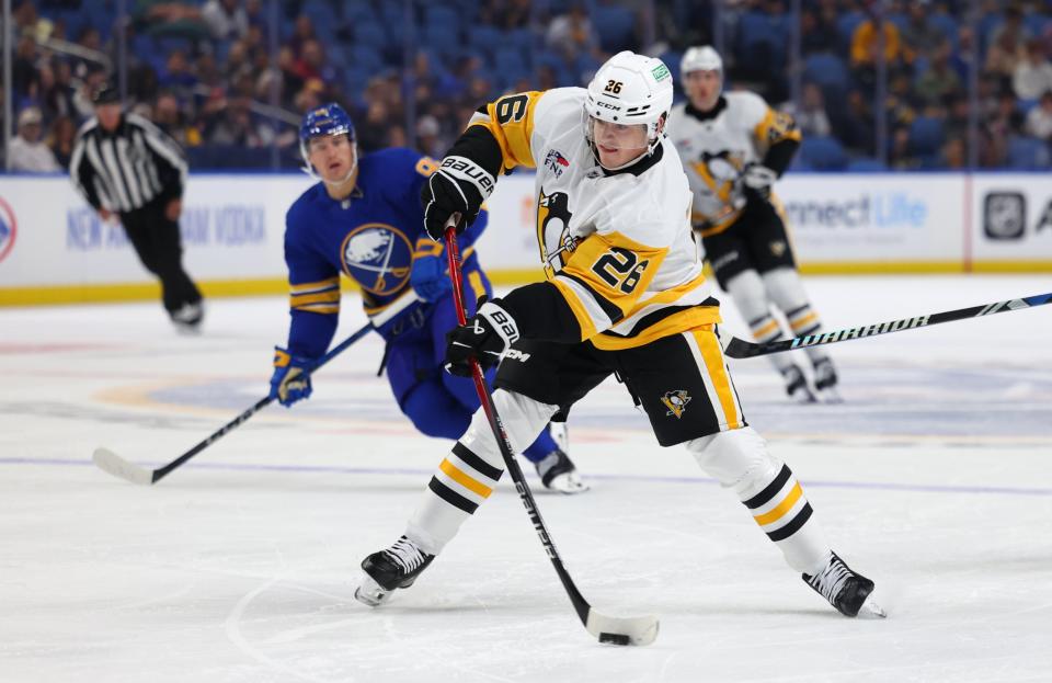 Sep 21, 2024; Buffalo, New York, USA; Pittsburgh Penguins center Tristan Broz (26) takes a shot on goal during the first period against the Buffalo Sabres at KeyBank Center. (Timothy T. Ludwig-Imagn Images)