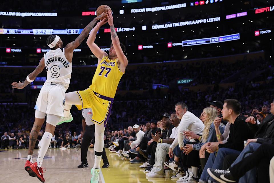 Luka Doncic makes a three-pointer just before the shot clock expires during the fourth quarter against the Timberwolves.