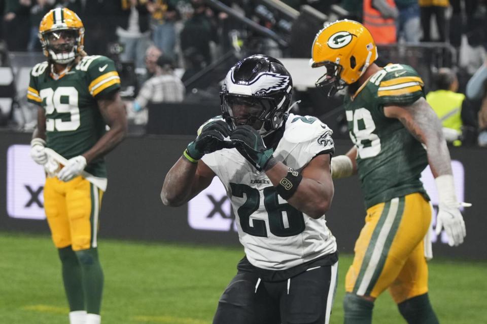 The Eagles' Saquon Barkley celebrates his touchdown against the Packers in their season opener in Brazil last fall.