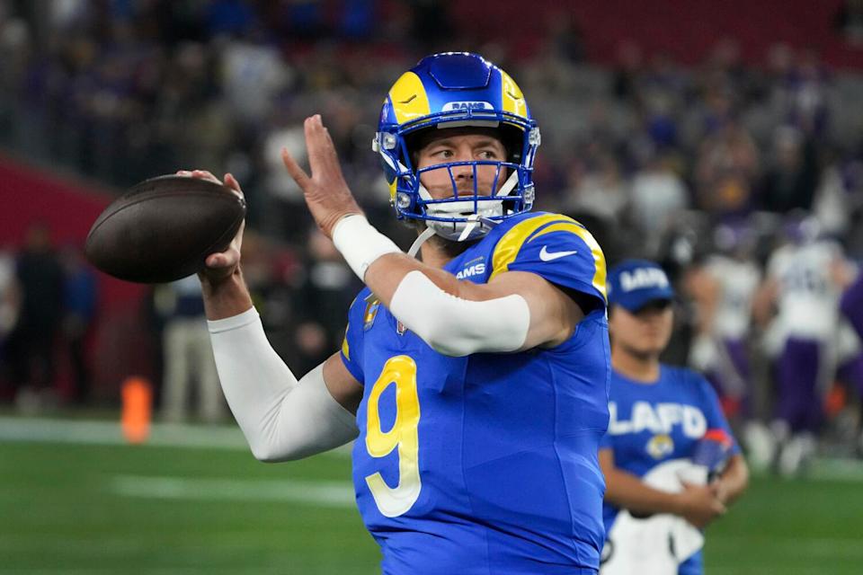 Rams quarterback Matthew Stafford throws before an NFL wild card playoff.