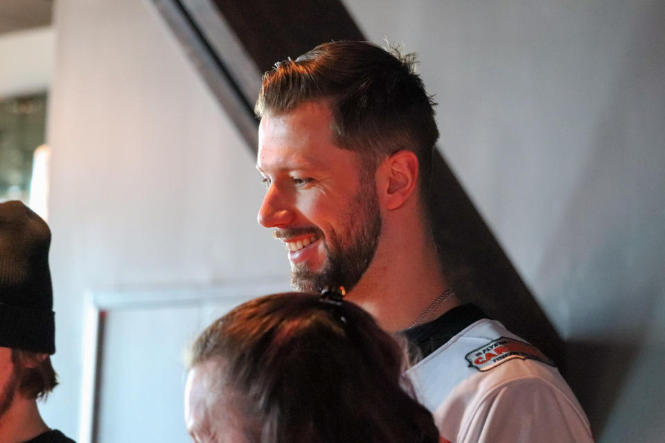 Philadelphia Flyers goaltender Ivan Fedotov (82) smiles during a game of cornhole. (Megan DeRuchie-The Hockey News)