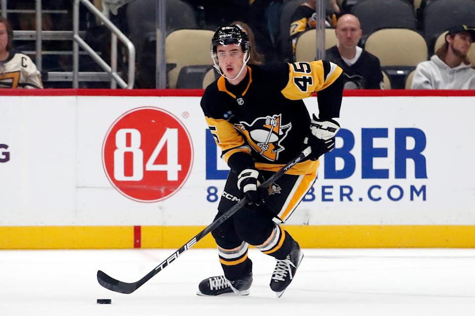 Oct 4, 2024; Pittsburgh, Pennsylvania, USA; Pittsburgh Penguins defenseman Harrison Brunicke (45) skates with the puck against the Columbus Blue Jackets during the third period at PPG Paints Arena. (Charles LeClaire-Imagn Images)