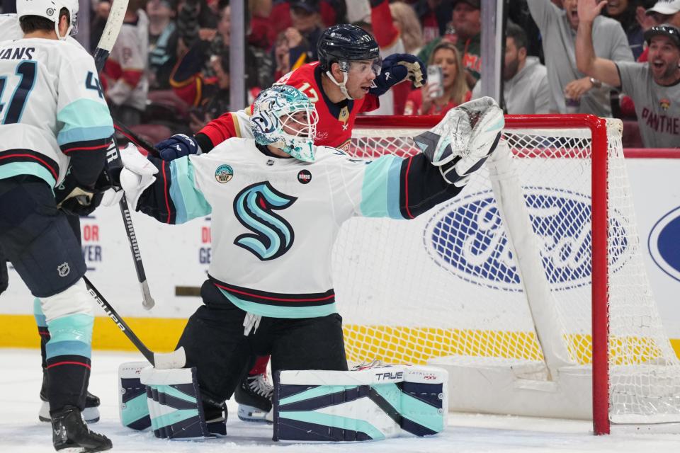 Feb 22, 2025; Sunrise, Florida, USA; Florida Panthers center Evan Rodrigues (17) gets called for interference on Seattle Kraken goaltender Joey Daccord (35) during the second period at Amerant Bank Arena. (Jim Rassol-Imagn Images)