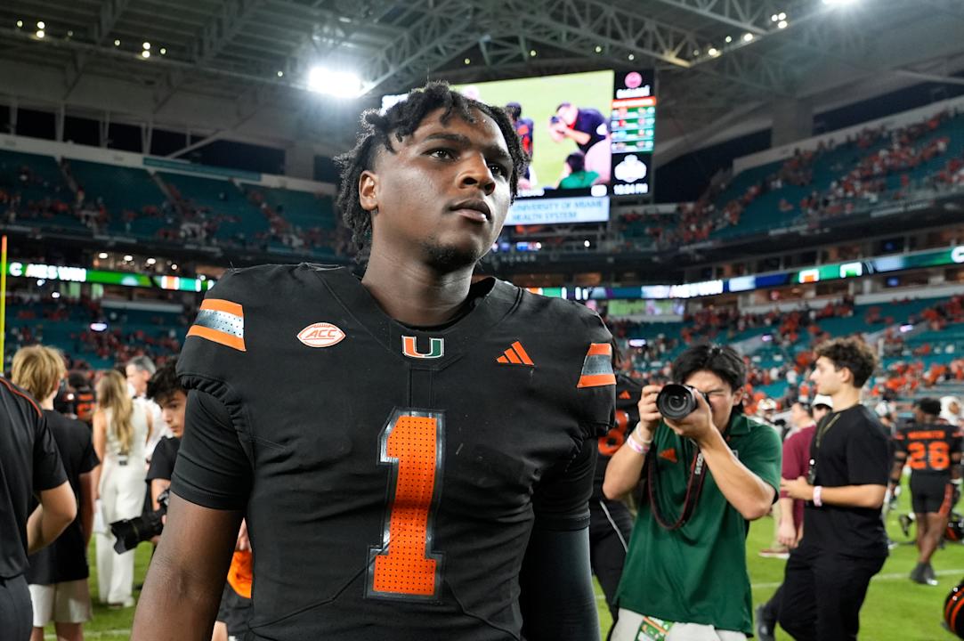 FILE - Miami quarterback Cam Ward (1) walks off the field after an NCAA college football game against Florida State, Oct. 26, 2024, in Miami Gardens, Fla. (AP Photo/Lynne Sladky, File)