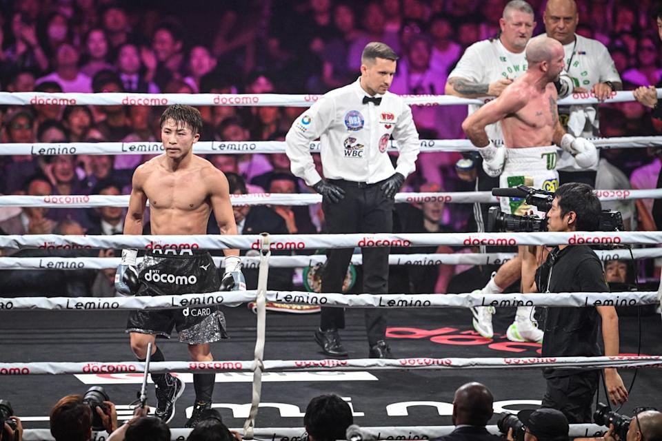 TJ Doheny clutches his back after his fight with Naoya Inoue is waved off (AFP via Getty Images)