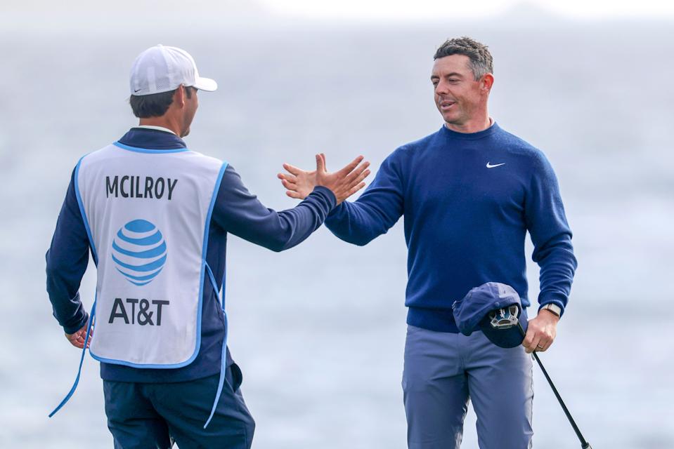 Rory McIlroy shakes hands with caddie Harry Diamond on the 18th hole after winning the 2025 AT&T Pebble Beach Pro-Am.