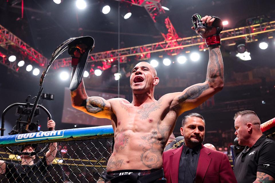 Pereira celebrates knocking out Jamahal Hill to retain the UFC light-heavyweight title (Getty Images)