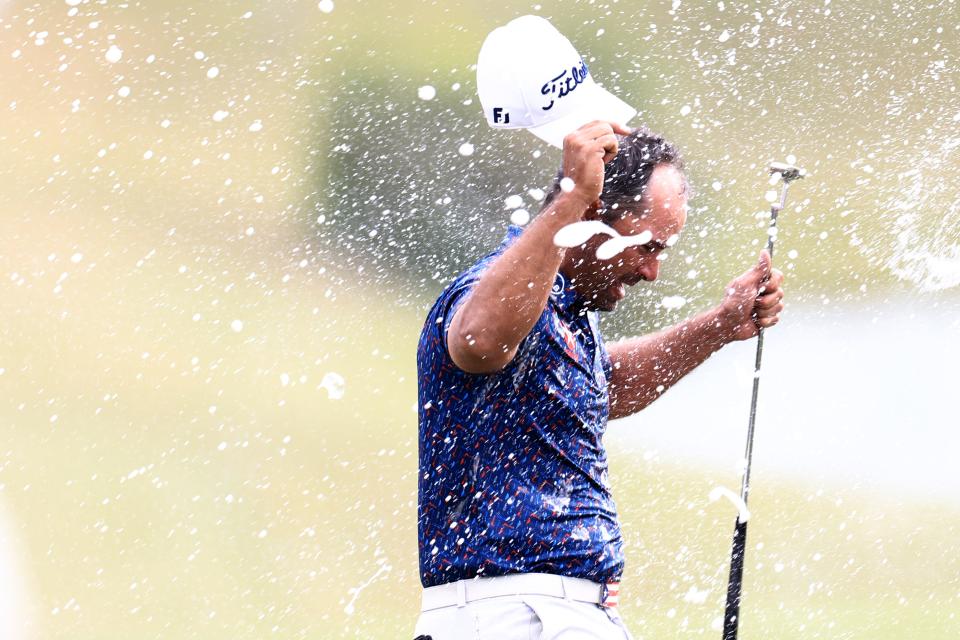 Rafael Campos of Puerto Rico is doused with Champagne after putting in to win on the 18th green during the final round of the Butterfield Bermuda Championship 2024 at Port Royal Golf Course on November 17, 2024 in Southampton, Bermuda. (Photo by Carmen Mandato/Getty Images)