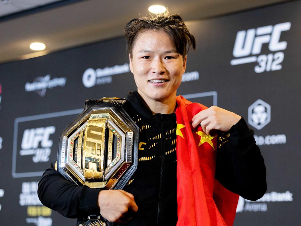 Zhang Weili of China poses with the belt during the press conference after defeating Tatiana Suarez of the United States in the women's strawweight championship at the UFC 312 in Sydney, Australia, Feb. 9, 2025. (Photo by Hu Jingchen/Xinhua via Getty Images)