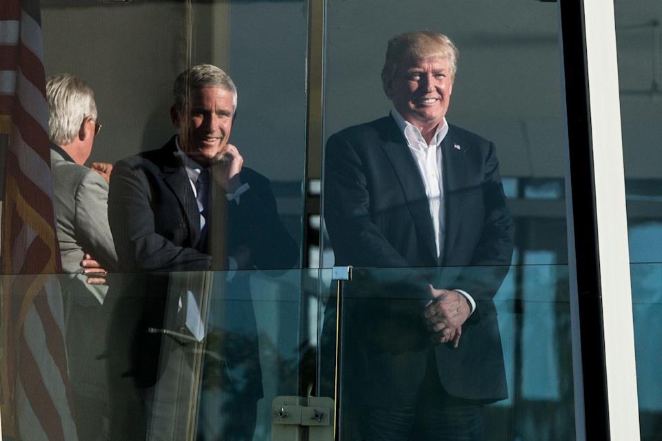 President Donald Trump (right) is working with PGA Tour Commissioner Jay Monahan to bring the world's best players together again with a merger of the Tour and the LIV Golf League.