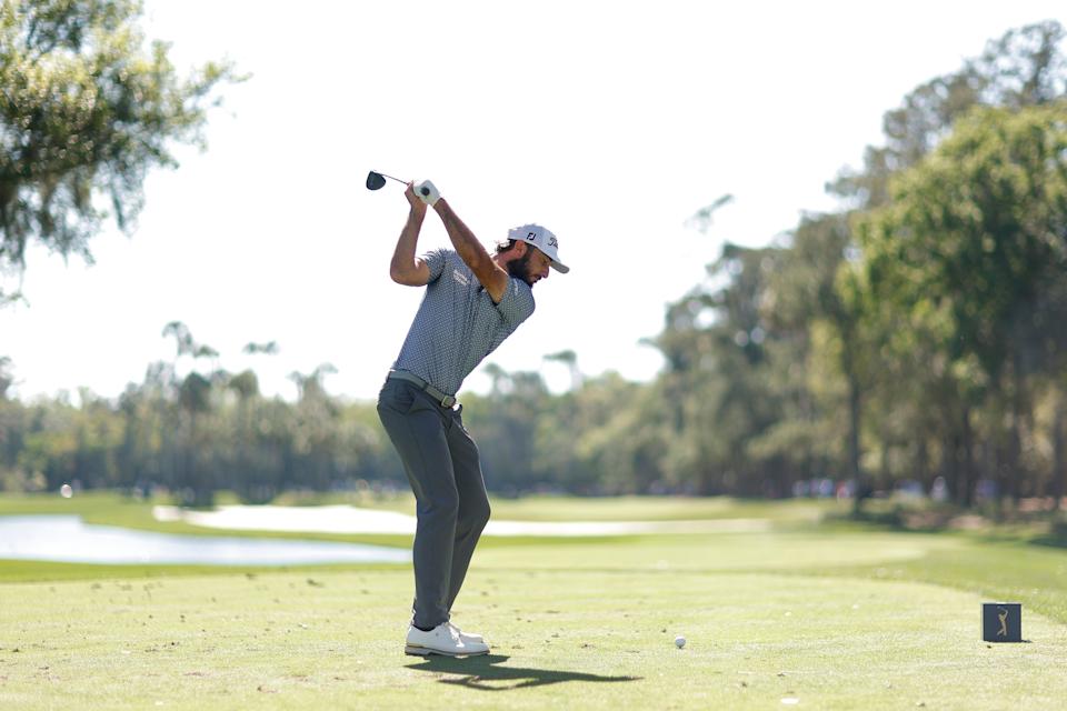 Max Homa hits his tee shot at the par-4 sixth hole of the Players Stadium Course during the 2023 Players Championship. However, a large tree has been transplanted to the right of the forward tee for the 2025 tournament.