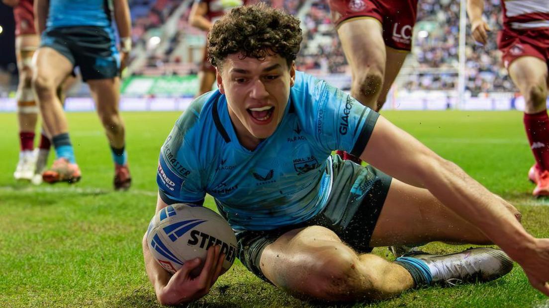 Hull FC's Lewis Martin diving to score a try against Wigan Warriors