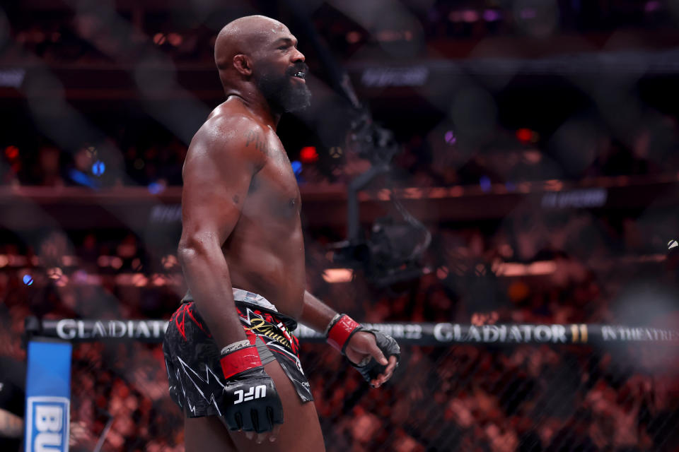 Nov 16, 2024; New York, NY, USA; Jon Jones (red gloves) reacts after defeating Stipe Miocic (not pictured) in the heavyweight bout during UFC 309 at Madison Square Garden. Mandatory Credit: Brad Penner-Imagn Images