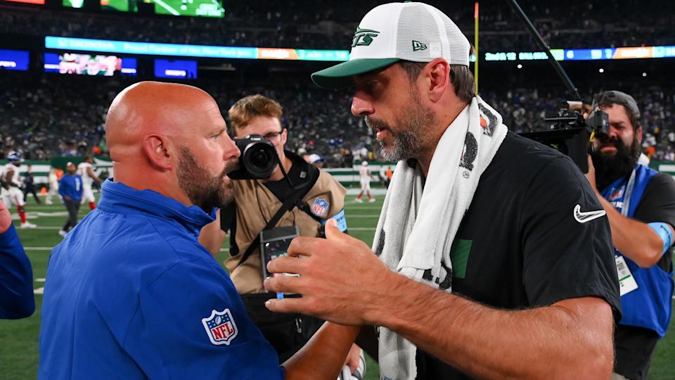 Aug 24, 2024; East Rutherford, New Jersey, USA; New York Giants head coach Brian Daboll (left) and New York Jets quarterback Aaron Rodgers (right) shake hands following the game at MetLife Stadium. Mandatory Credit: Rich Barnes-Imagn Images