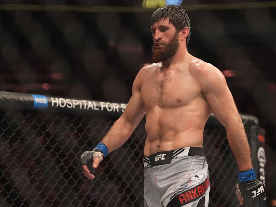 Dec 10, 2022; Las Vegas, Nevada, USA;  Magomed Ankalaev (blue gloves) reacts during the fight against Jan Blachowicz (red gloves) during UFC 282 at T-Mobile Arena. Mandatory Credit: Stephen R. Sylvanie-USA TODAY Sports