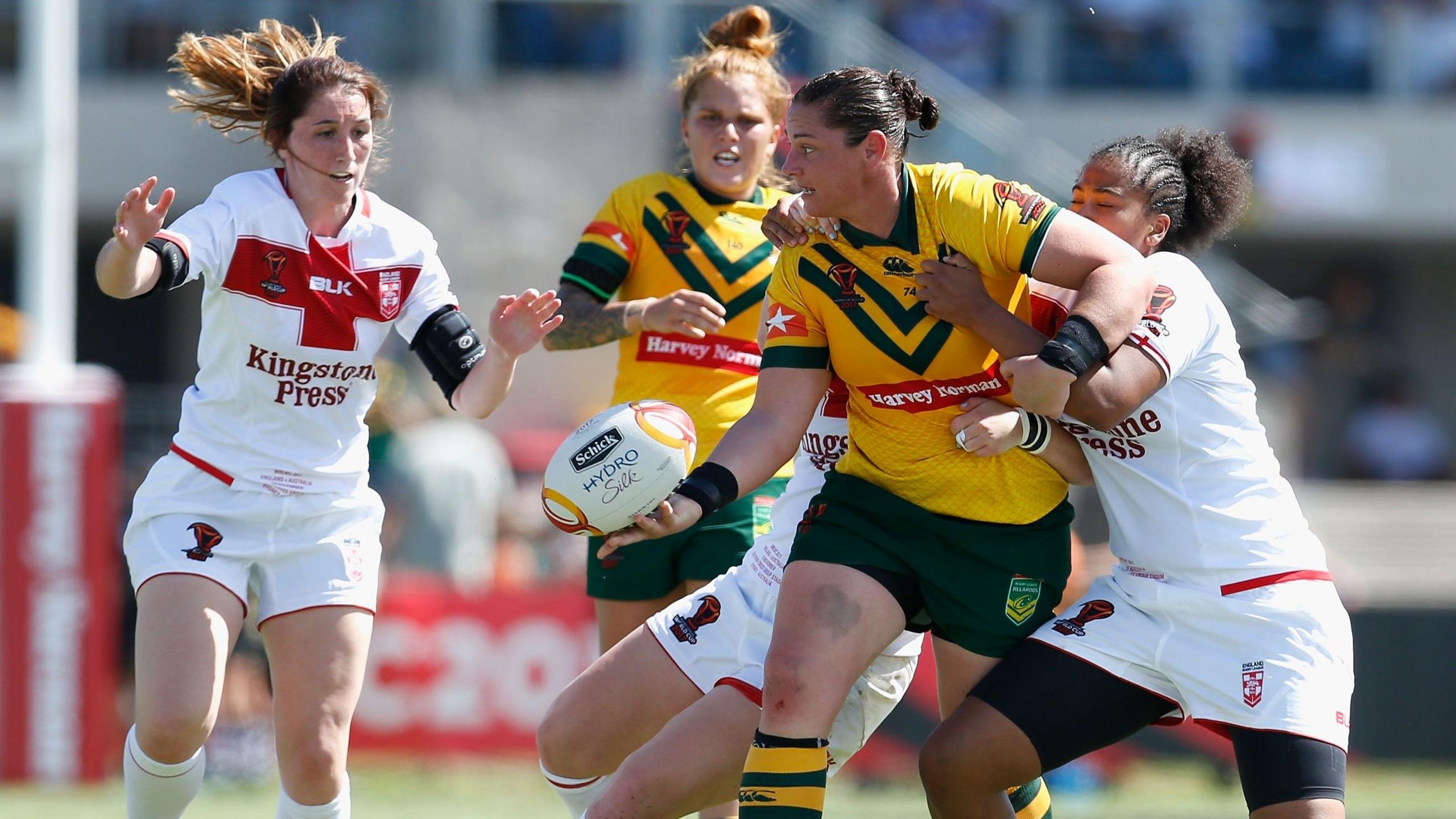 Australia's Steph Hancock passes under pressure from England players