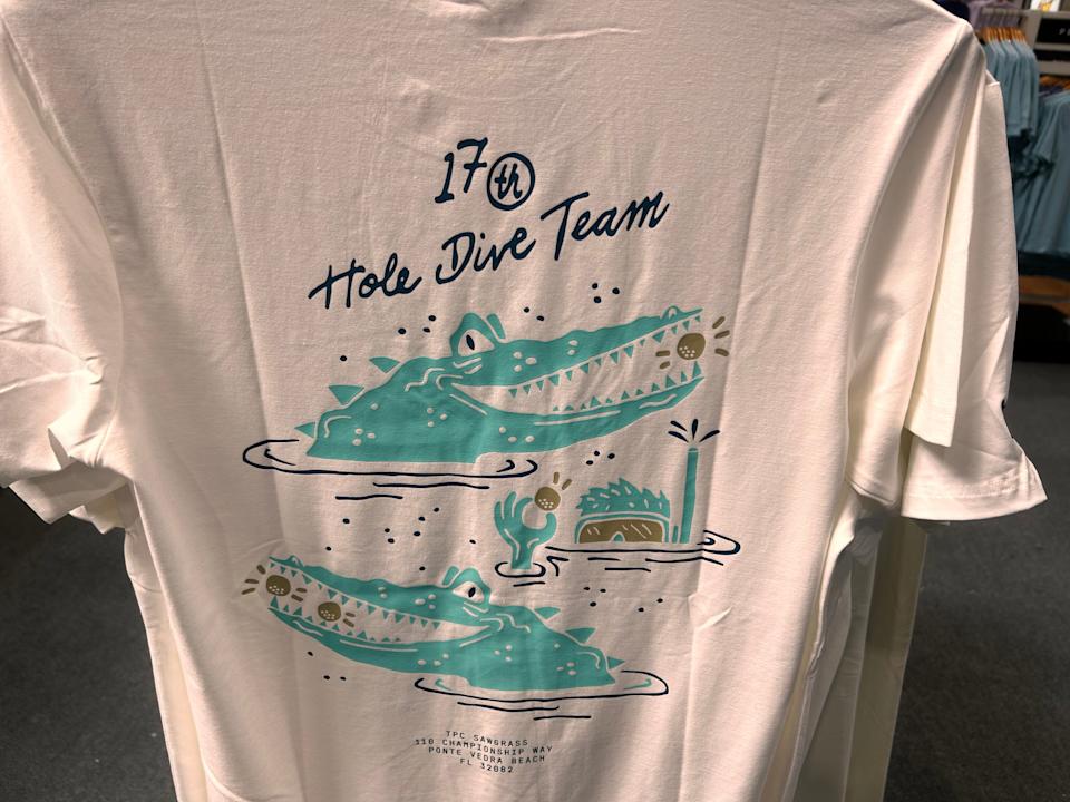 A humorous example of a T-shirt depicting the Island Green is one of the many items at the PGA Tour Fan Shop that can be found honoring the 17th hole of the Players Stadium Course.