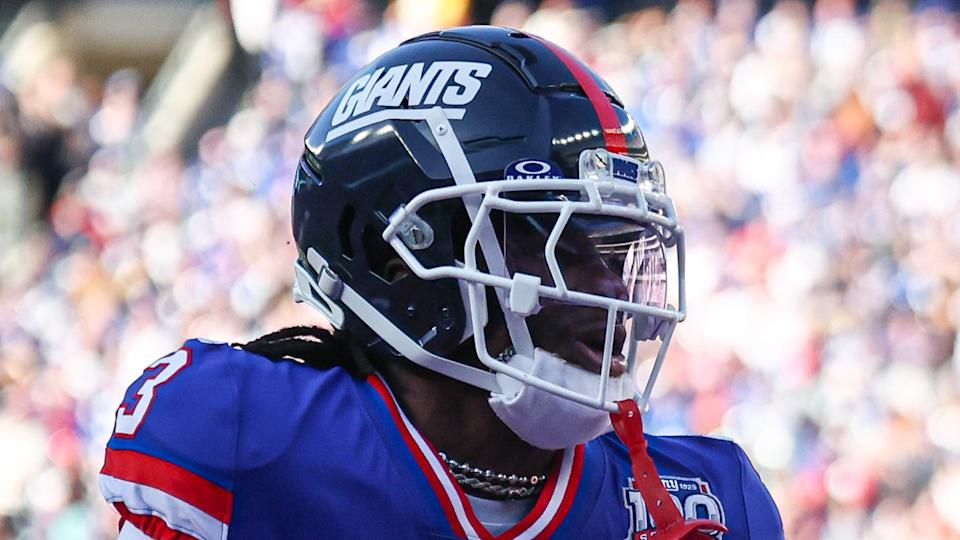 Nov 3, 2024; East Rutherford, New Jersey, USA; Washington Commanders wide receiver Terry McLaurin (17) catches a touchdown pass as New York Giants cornerback Deonte Banks (3) defends during the first half at MetLife Stadium. Mandatory Credit: Vincent Carchietta-Imagn Images