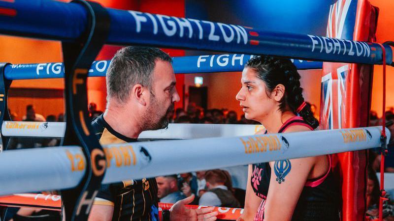 Charan Kaur Dhesi in her corner with her coach during the fight with Amy Greatorex