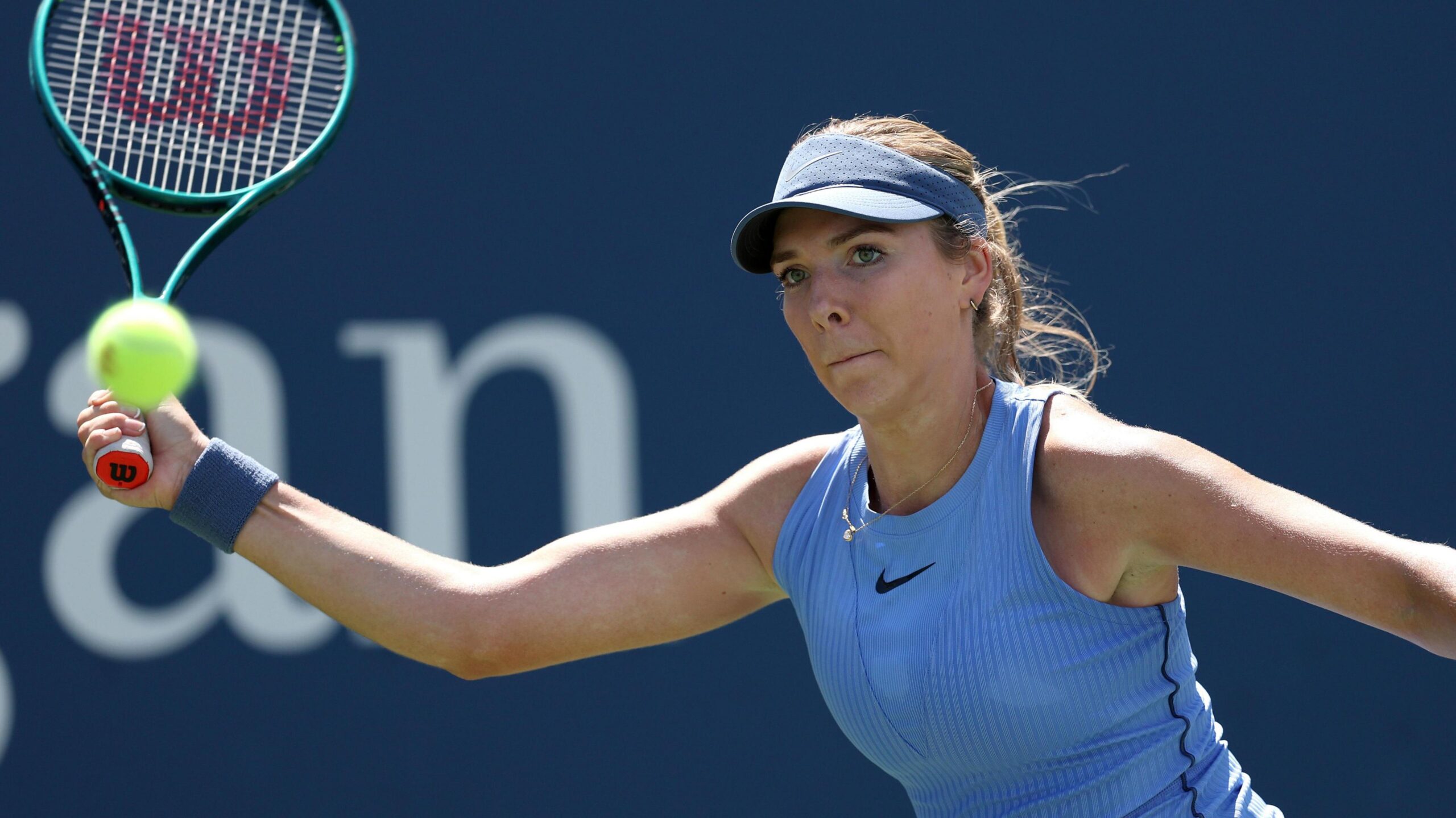 Katie Boulter reaches for a forehand return