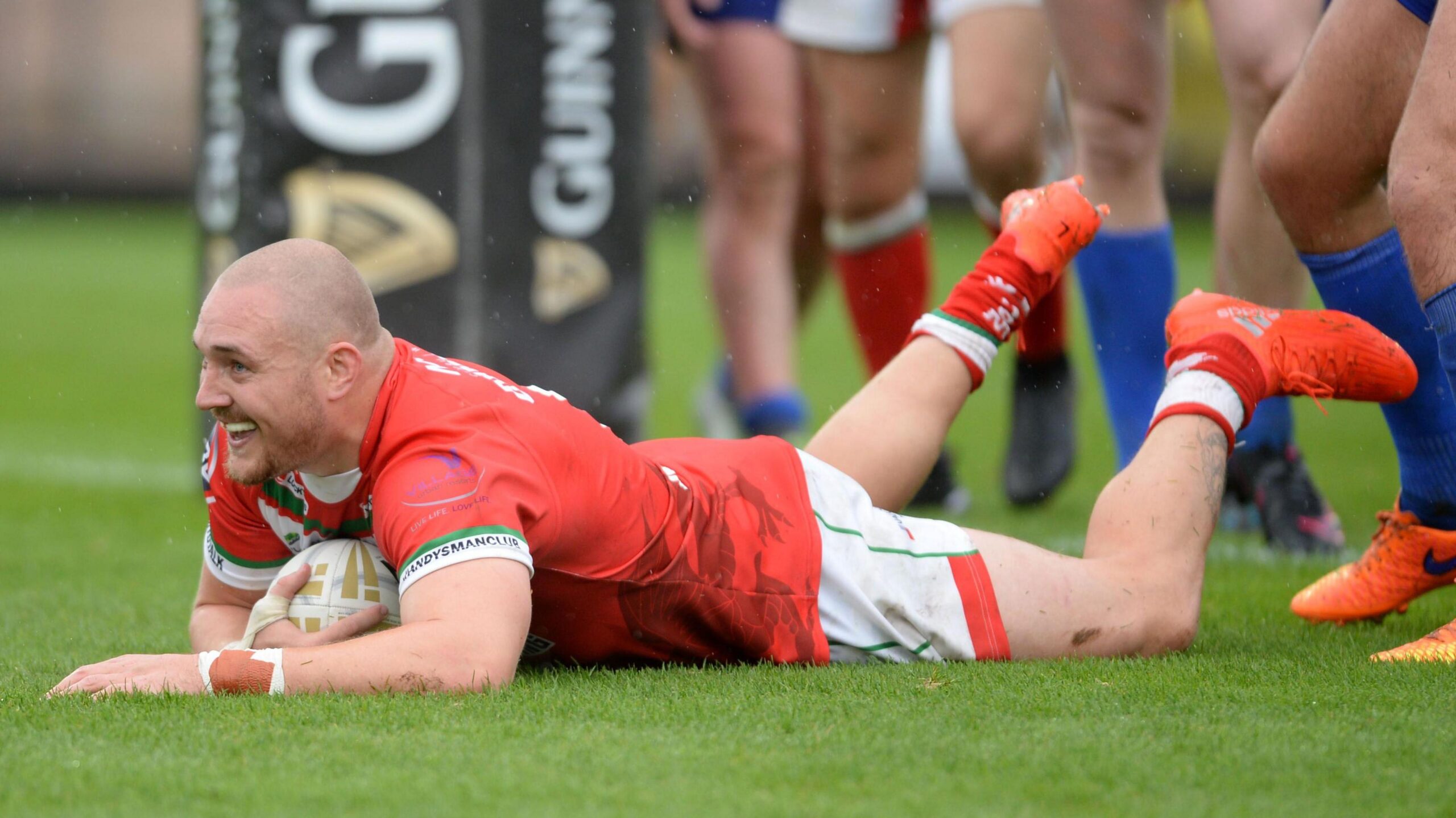 Gil Dudson scores a try for Wales against Serbia in 2013