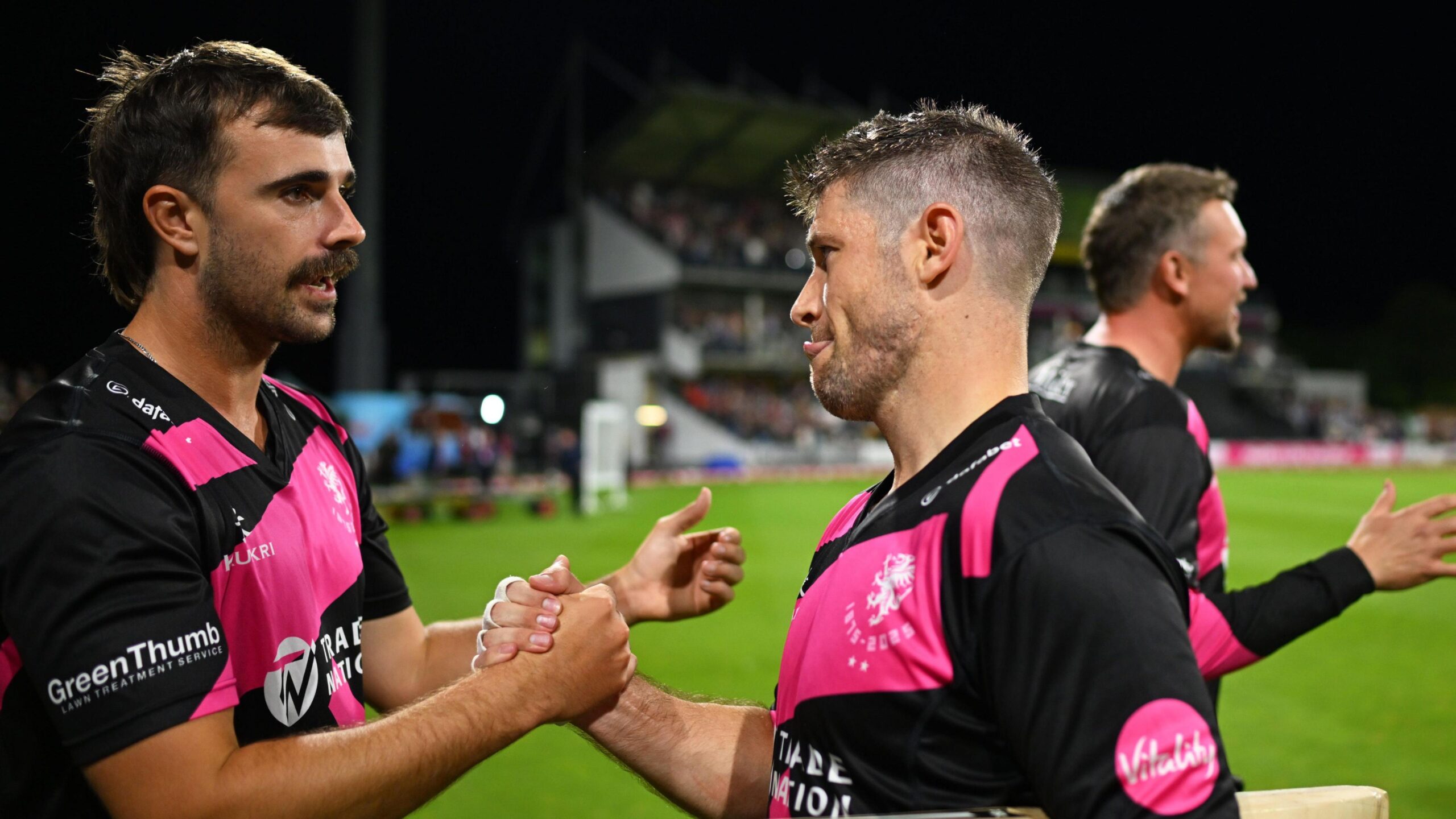 Ben Green (left) grabs the hand of Sean Dickson after the Somerset batter's match-winning innings against Bears
