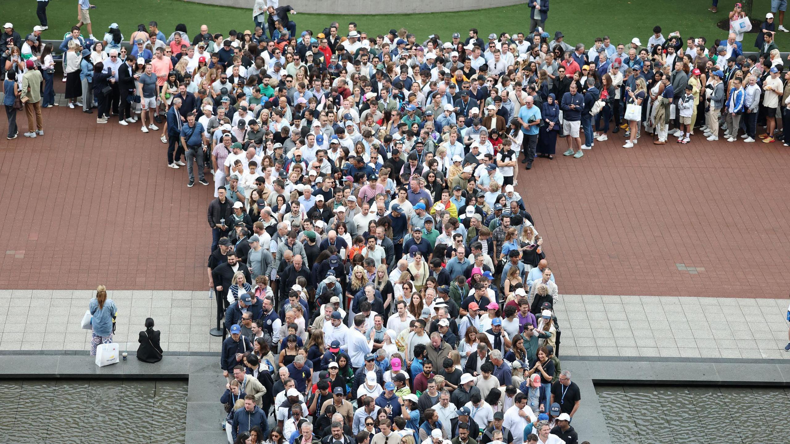 Fans queue outside Arthur Ashe Stadium
