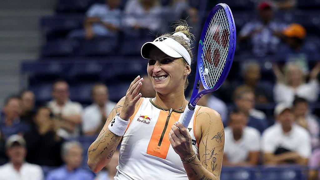 Marketa Vondrousova celebrates after beating Elena Rybakina