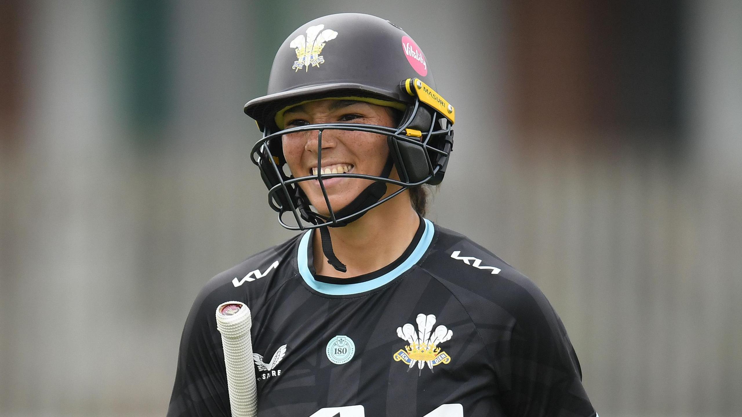 Emma Jones leaves the field with a smile on her face after being out for 141 v Essex at Beckenham