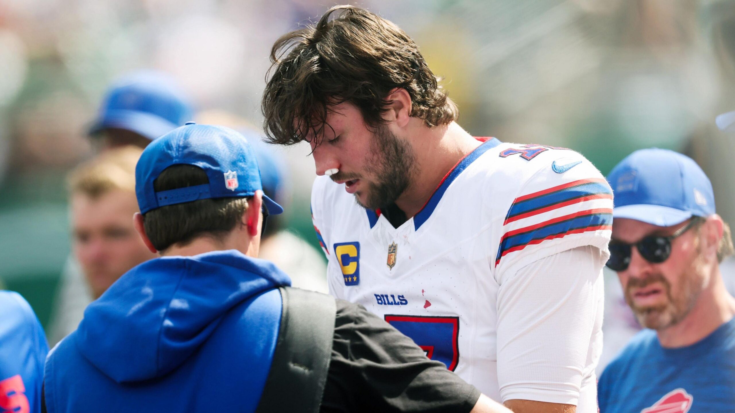 Bufalo Bills quarterback Josh Allen gets treatment for a nose injury