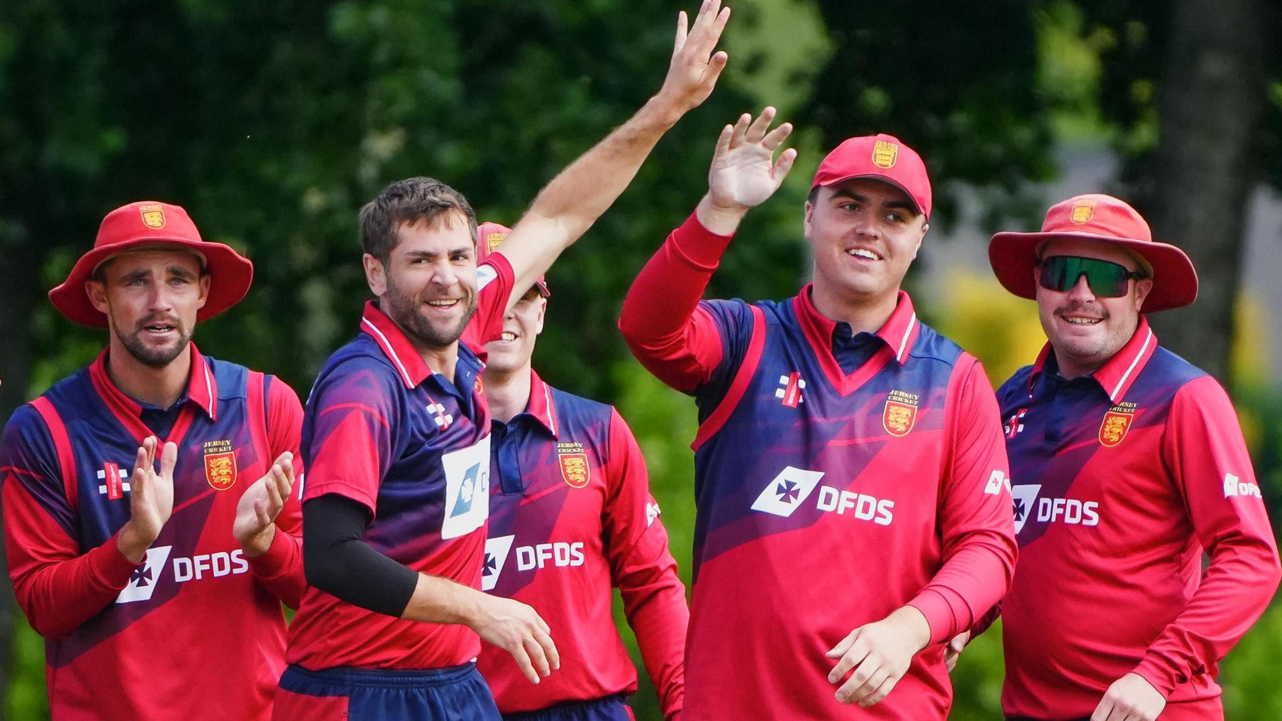 Captain Charles Perchard celebrates with his Jersey team-mates