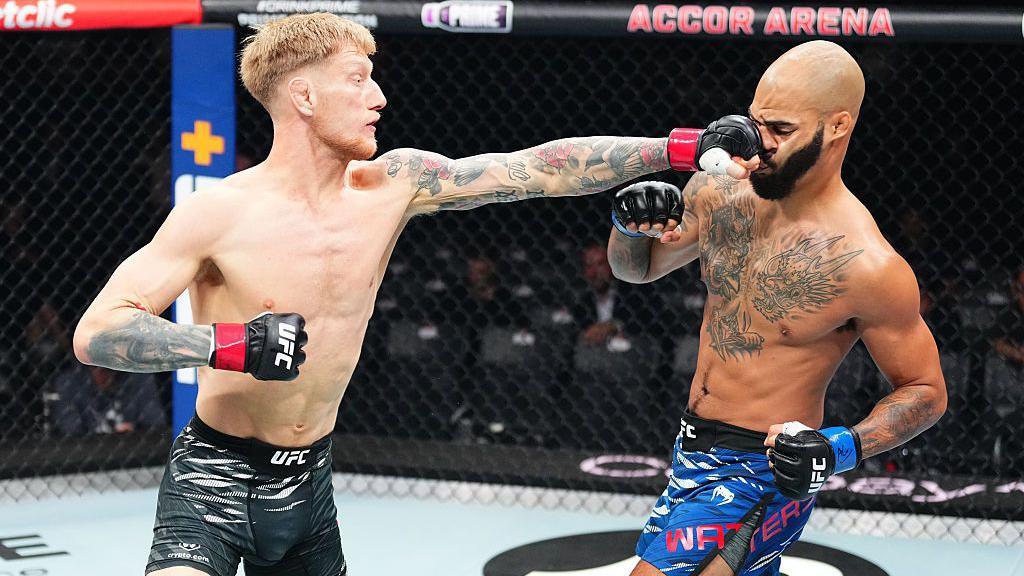 Sam Patterson punches Trey Waters