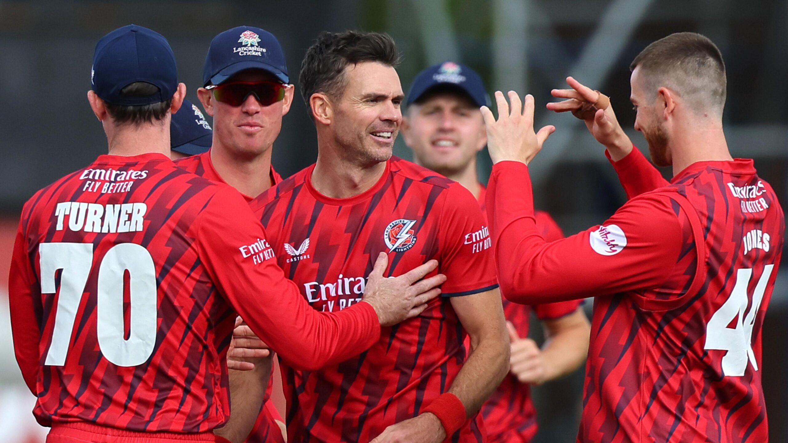Jimmy Anderson (centre) is congratulated by four Lancashire players for taking a wicket in the T20 Blast